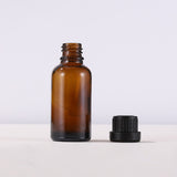 Empty amber essential oil bottle