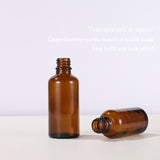 Empty amber essential oil bottle